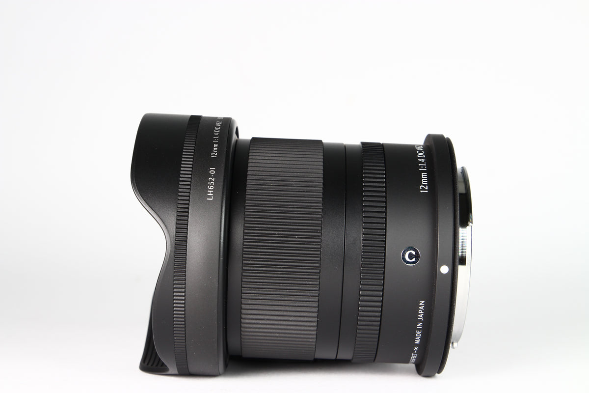 Lente Sigma 12mm Contemporary DC F:1.4 Para Canon RF-S. Usado